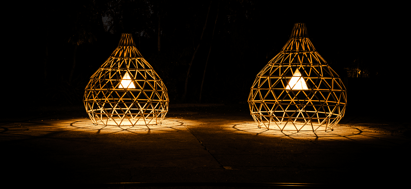 Illuminated bamboo structures at night
